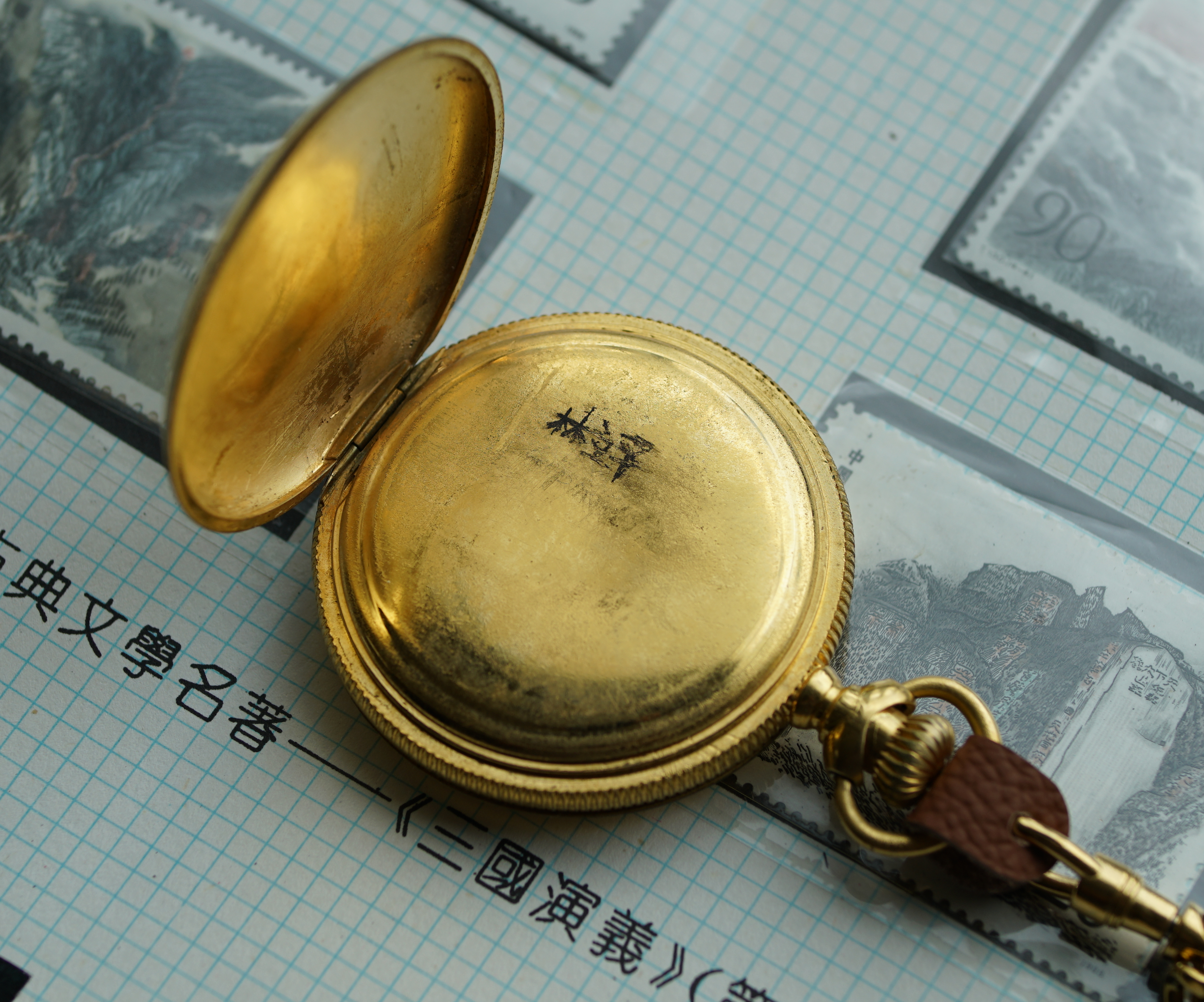 Close view of the Elgin pocket watch movement plates, balance, and regulator