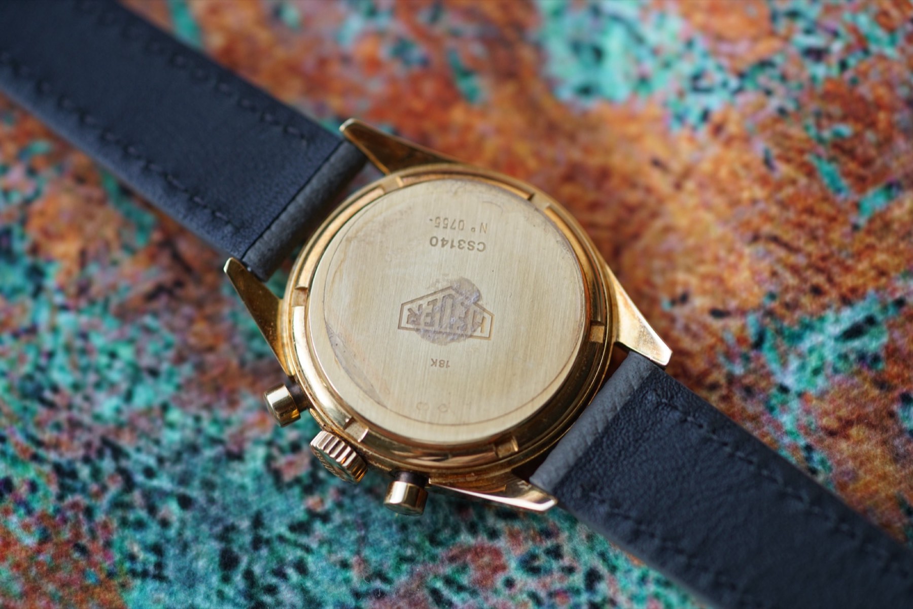 Solid-gold Heuer caseback engraved CS3140 and number 0765