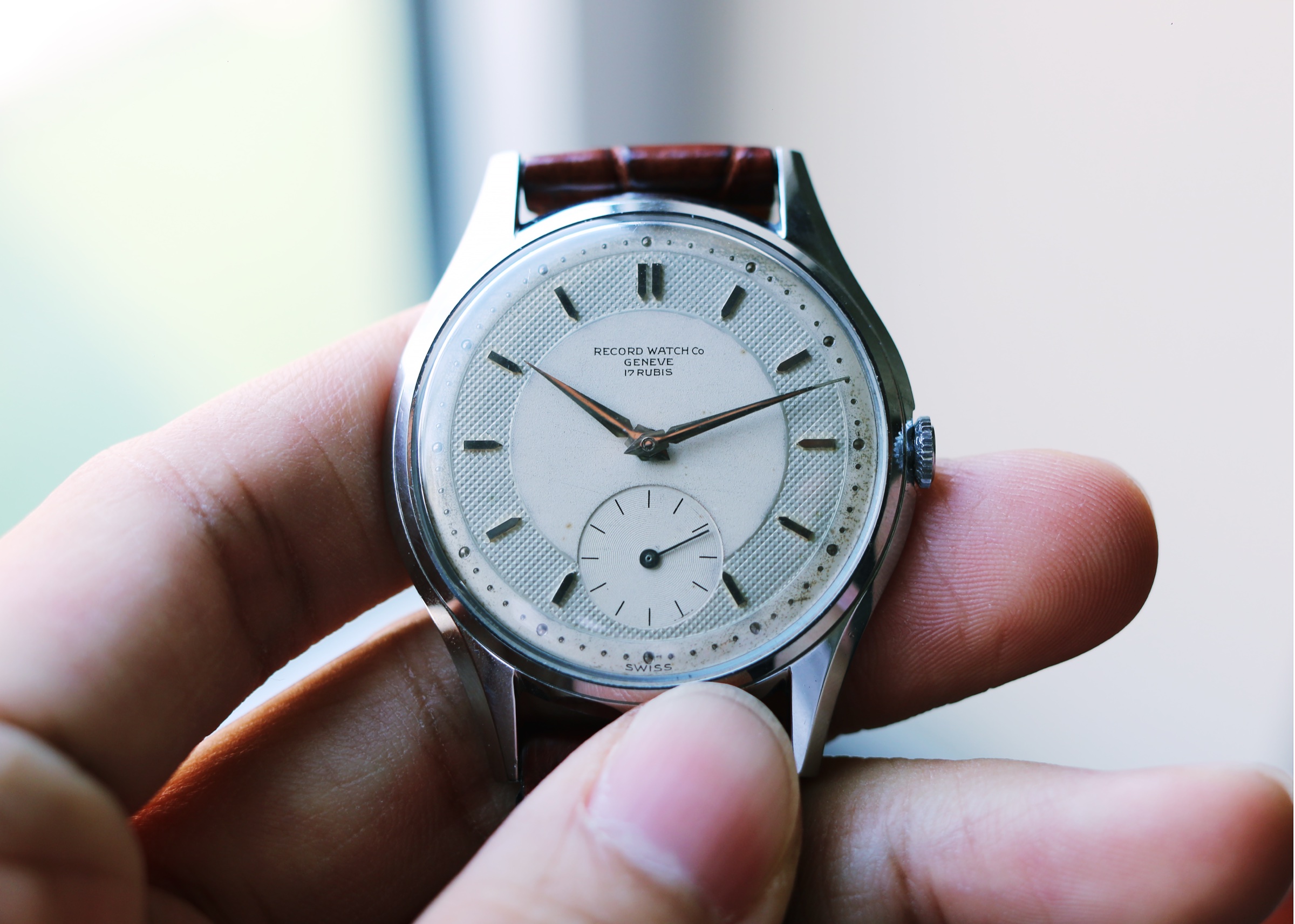 Owner photograph of a jumbo 1950s Record Genève dress watch with a waffle dial and faceted lugs