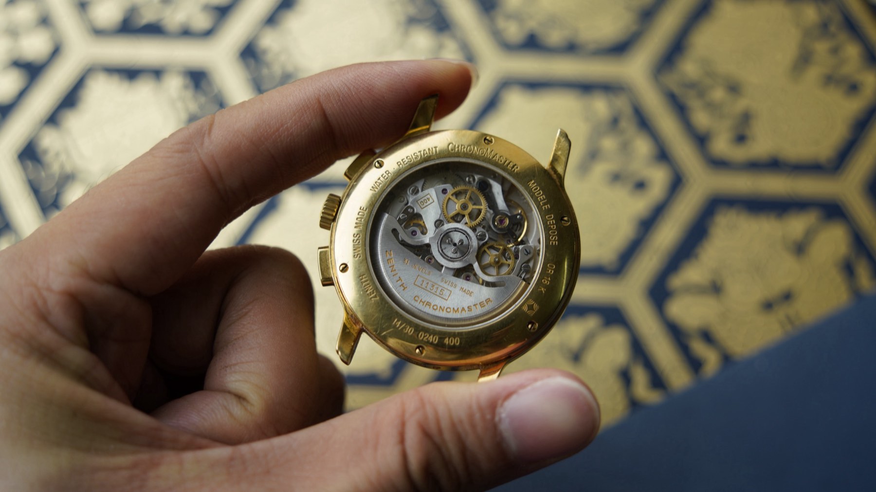 Six-screw gold caseback ring engraved ZENITH AUTOMATIC SWISS MADE